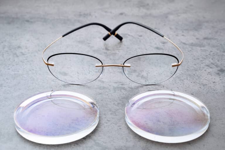 New lenses and frame for eyeglasses production lying on table in optic