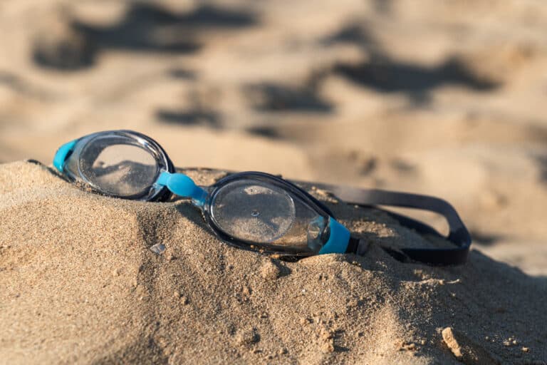 Sun glasses on a tropical beach sand, summer holiday
